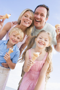 family enjoying ice cream in summer